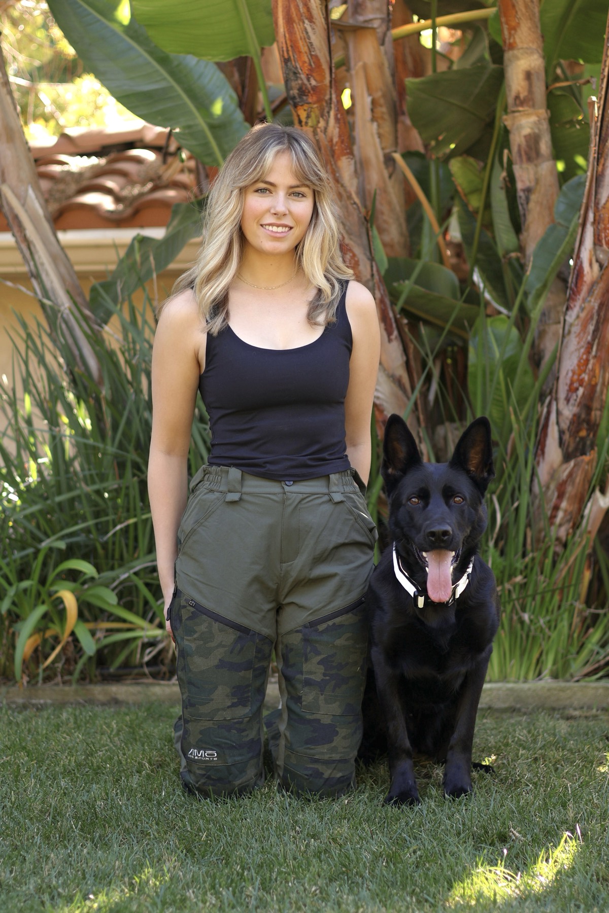 Ashley with a client's shepherd in the garden